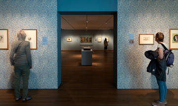 Visitors inside the Pre-Raphaelites exhibition Visitors inside the Pre-Raphaelites exhibition